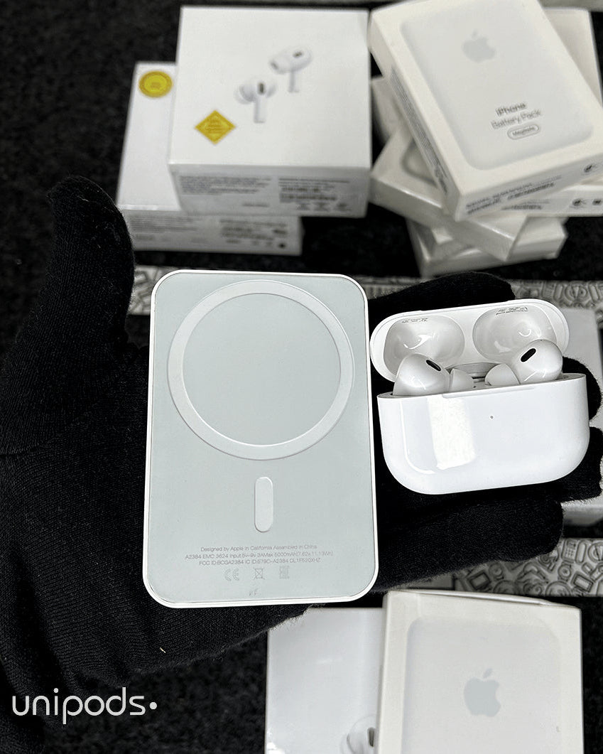 White wireless earbuds in a case with 'unipods' branding on a dark background.